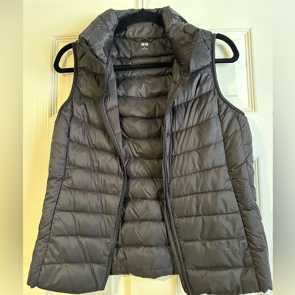 Uniqlo ultra lightweight packable down vest in black.